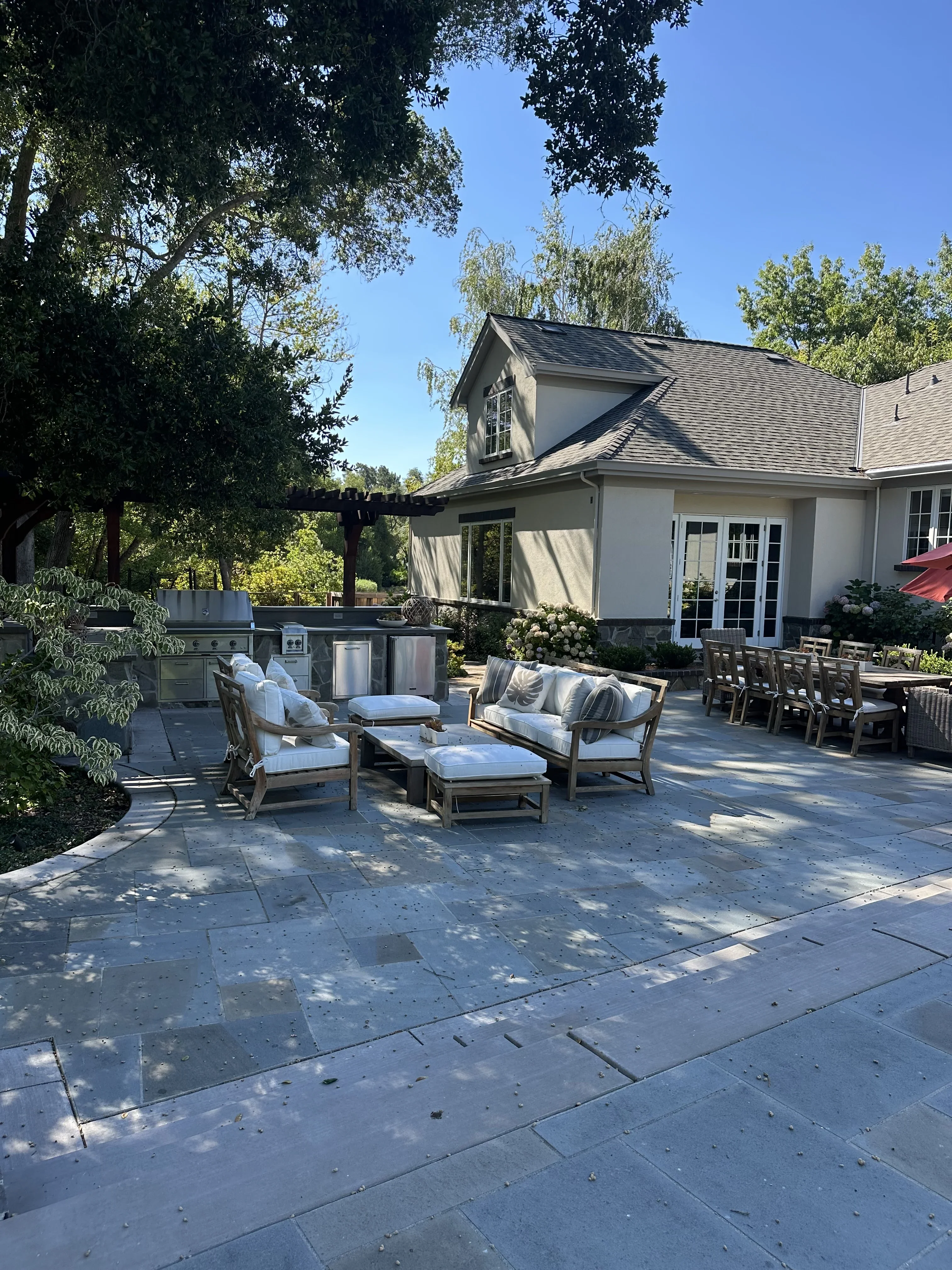 Residential landscape planting with paths and established greenery